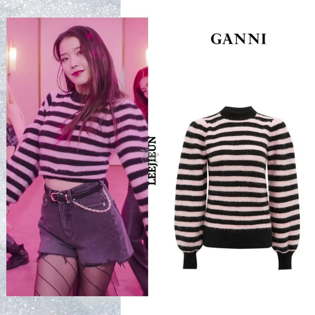Trong những phân cảnh thể hiện vũ đạo, IU diện áo sweater của thương hiệu Ganni mix cùng quần shorts. Nhưng đáng chú ý là trong MV, chiếc áo đã được cắt xén thành dáng croptop để thêm phần khỏe khoắn và năng động